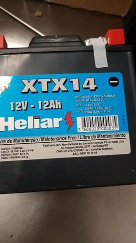 Vendo ou troco bateria de moto heliar selada